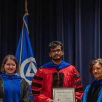 Provost Mili and 2 faculty pose for pictures